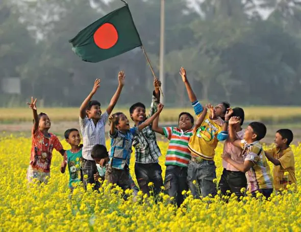 Village children hoisting flag on Victory Day